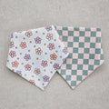Two fabric bands with floral and checkered patterns on a gray background